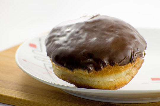 Chocolate donut on on the plate