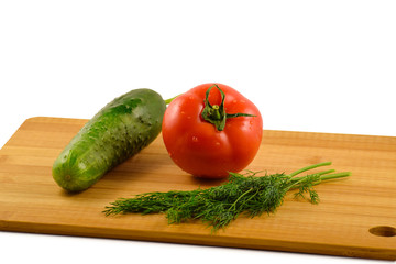 Tomato, cucumber and dill on a white background.