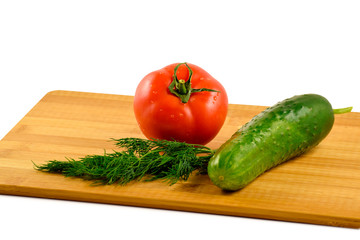 Tomato, cucumber and dill on a white background.