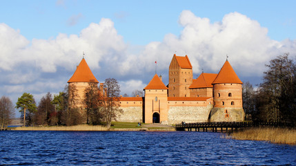 Beautiful scenic view of medieval red brick Trakai castle across the lake, island ancient castle are one of the most popular touristic destination in Lithuania, sunny day