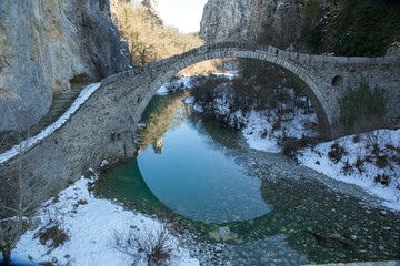 bridge old in Ioannina Zagori Greeece snow ice winter time