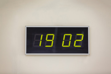 Black digital clock on a white background showing time 19 02 US President's Day