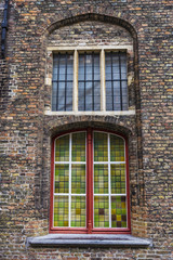 Obraz premium Windows of an old classic building in Bruges, Belgium