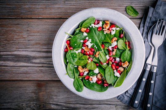 Fresh Green Salad With Spinach, Walnuts, Feta Cheese And Pomegranate