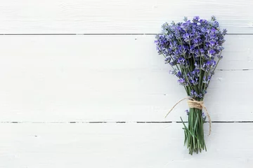Poster Lavender flowers on white wooden background © KashtykiNata