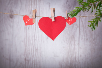 Valentine Hearts with handmade angels on a wood background, a good congratulatory card.