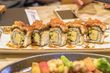 Sushi roll with salmon and shrimp tempura