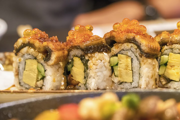 Sushi roll with salmon and shrimp tempura