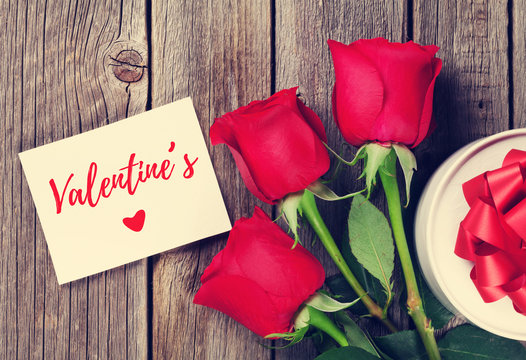 Red roses and Valentines day greeting card