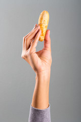 Woman's hand holding a tequeño