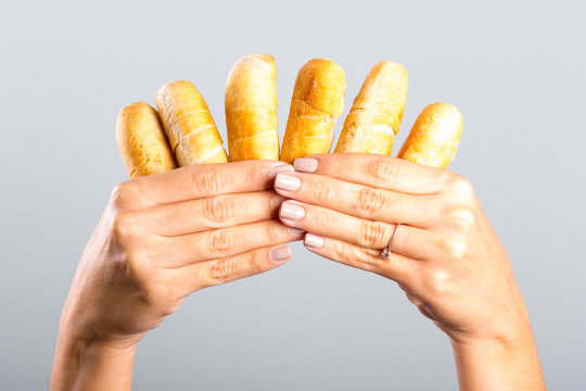 woman's hand holding cheese fingers