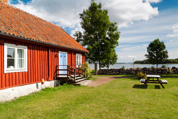 Fototapeta na wymiar Typical red wooden house in Sweden