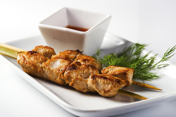 Pieces of fried chicken on a stick