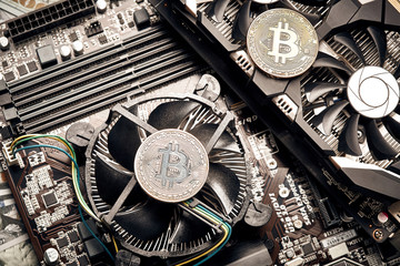 Bitcoin. New virtual money. Bitcoins lie on the video card, concept of mining.