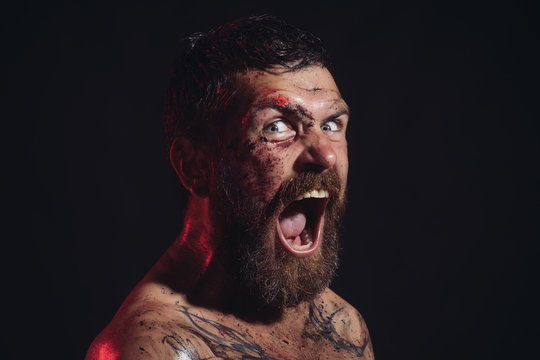 Hipster with beard, mustache shout with horror on black background