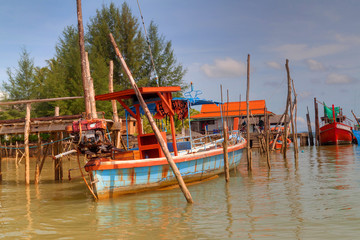 Thai long tail boats in the harbour, Thailand