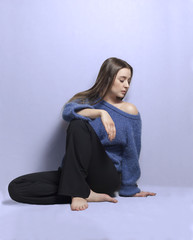 a beautiful girl in knitted blue jumper