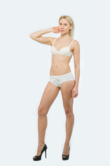 Fototapeta premium Portrait of a beautiful Blonde Woman in white underwear