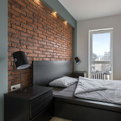 Industrial style bedroom with bed