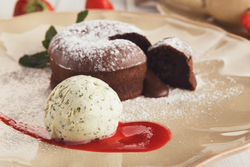 Chocolate fondant with vanilla ice cream and strawberry