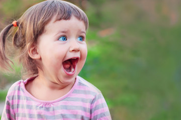 Little girl is surprised and happy