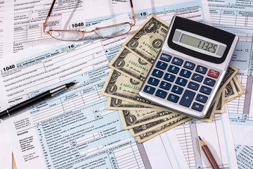 financing concept - filling in the tax form