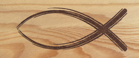 Christian fish symbol web banner on wood. Religious sign