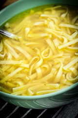 Broth - chicken soup in a bowl.