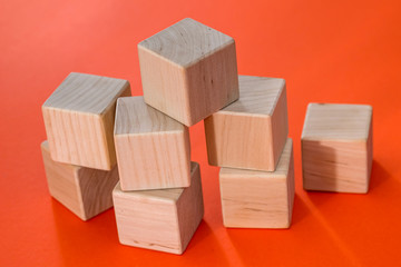 empty wooden cubes blocks  isolated on orange background