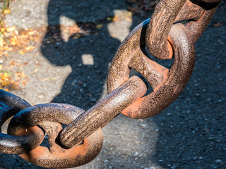 vintage ship anchor chain covered with rust close up