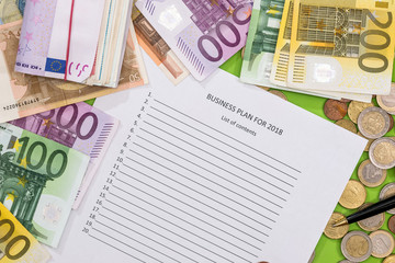 2018 new year goals with euro, pen and calculator