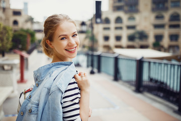 happy laughing girl on city walk.