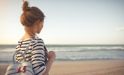 happy woman enjoying freedom with open hands on sea