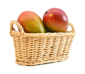 fresh mango fruit in basket on a white background