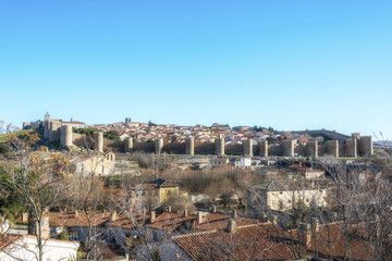 Fototapeta na wymiar Panoramic view of the historic city Avila with its famous medieval town walls surround at the sunny winter day, Spain