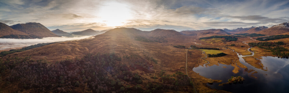 landscape view of scotland and loch tulla in the remote highlands of scotland during winter from an aerial viewpoint in panoramic landscape foramt