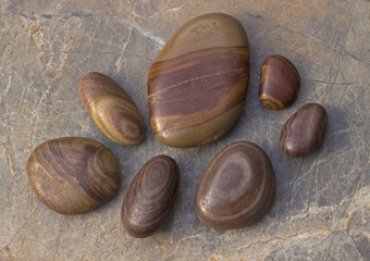 Beautiful patterned pebbles on marble