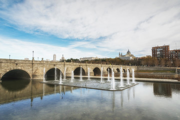 Fototapeta premium Fountains at the Segovia bridge on the Manzanares river. Madrid, Spain.