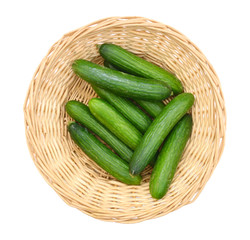 fresh cucumbers isolated in basket on white