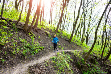 Girl running in the woods..