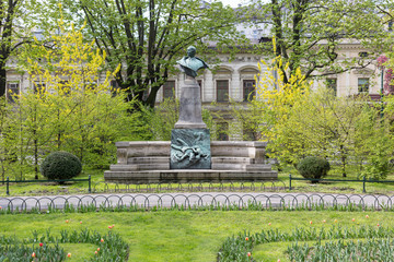 Fototapeta premium Statue of Artur Grottger in the Planty Park, Krakow, Poland