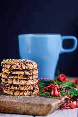 Nut biscuits with icing and a cup of milk