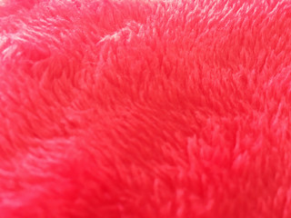 Fototapeta premium Soft red rug with short nap close-up, background