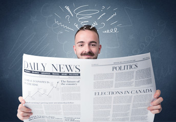 Businessman reading newspaper