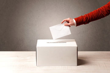 Ballot box with person casting vote