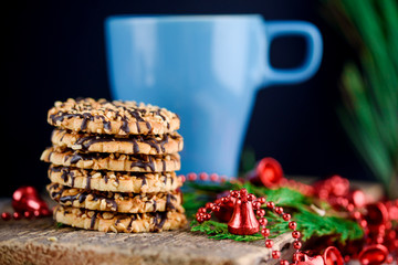 Nut biscuits with icing and a cup of milk