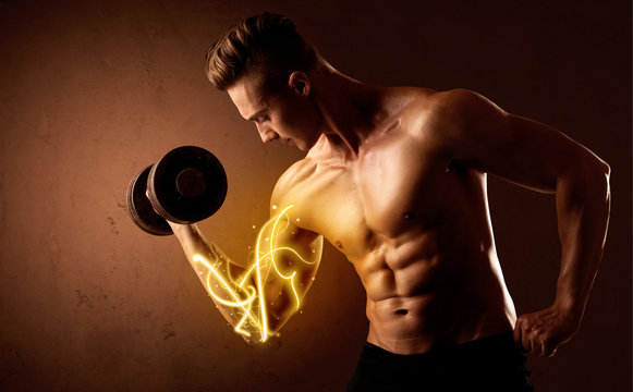 Muscular body builder lifting weight with energy lights on biceps