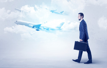 Obraz premium Businessman going somewhere with airplane