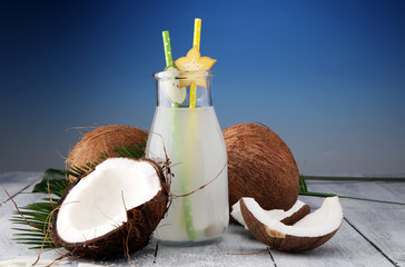 Coconut juice, Drink coconut water and coconuts on wooden background