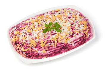 Russian Herring under a Fur Coat salad, close-up, isolated on white background.